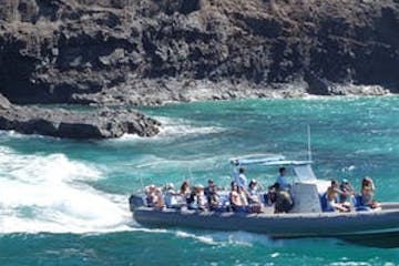 a group of people on a boat in the water