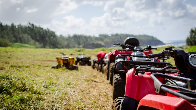 atvs lined up in the mountains