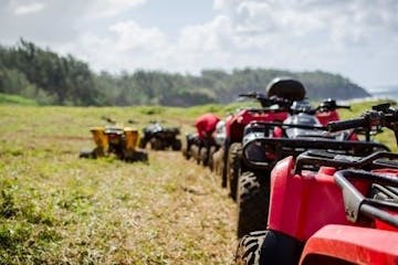 a line of atv's in a field