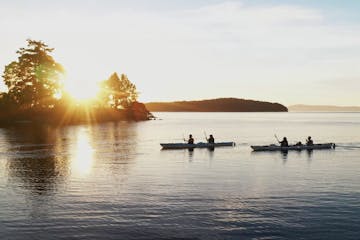 two kayaks at sunset