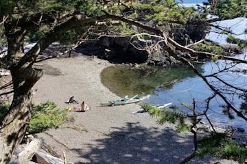 kayaks on a pebble beach