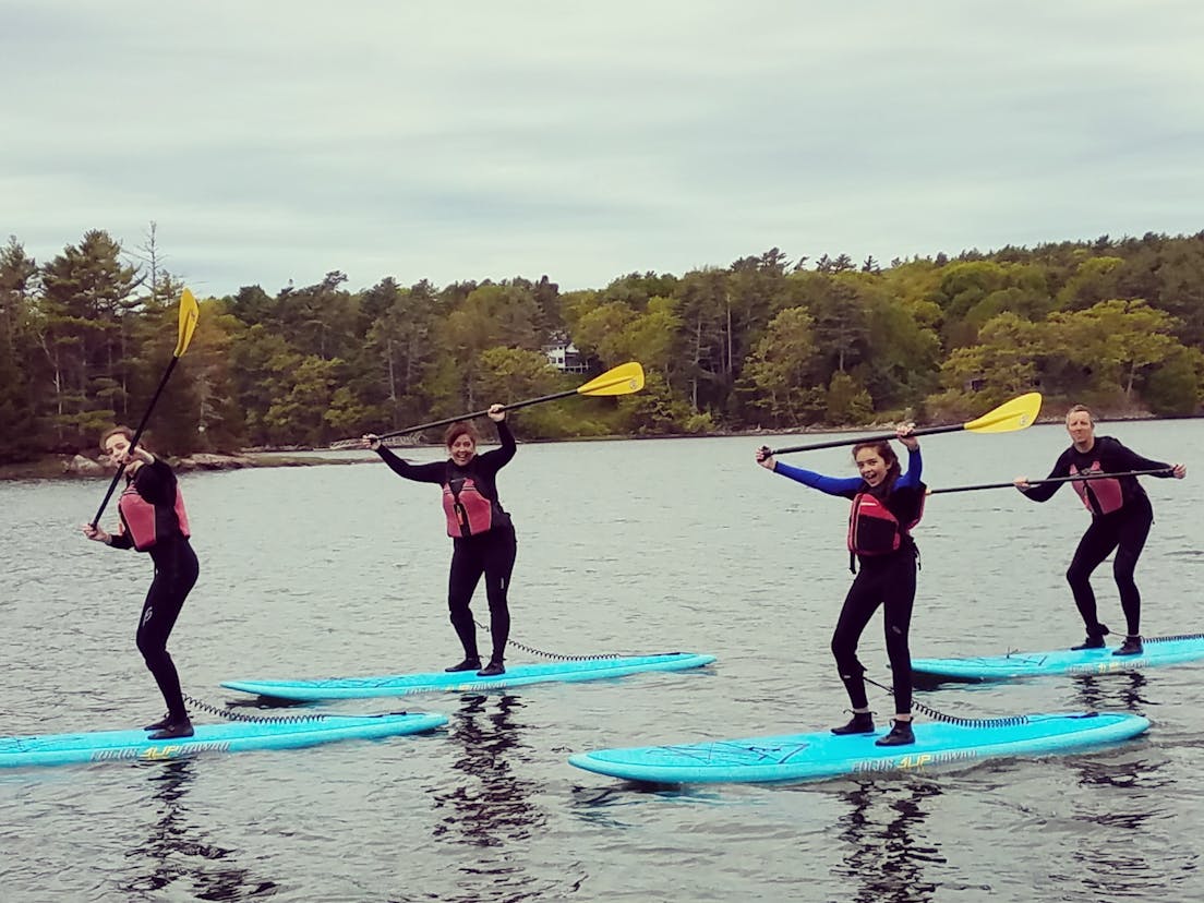 Girls on stand up paddleboards