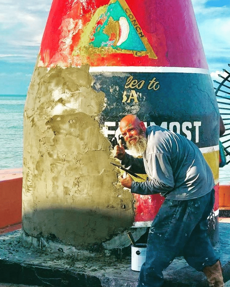 paniter repairing the Southernmost Point Bouy