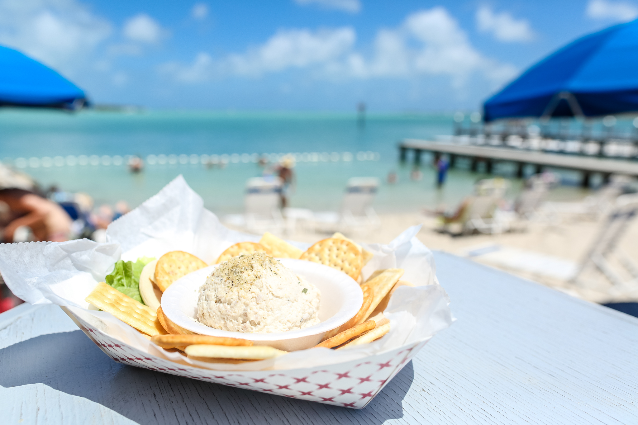 a sandwich sitting on top of a picnic table