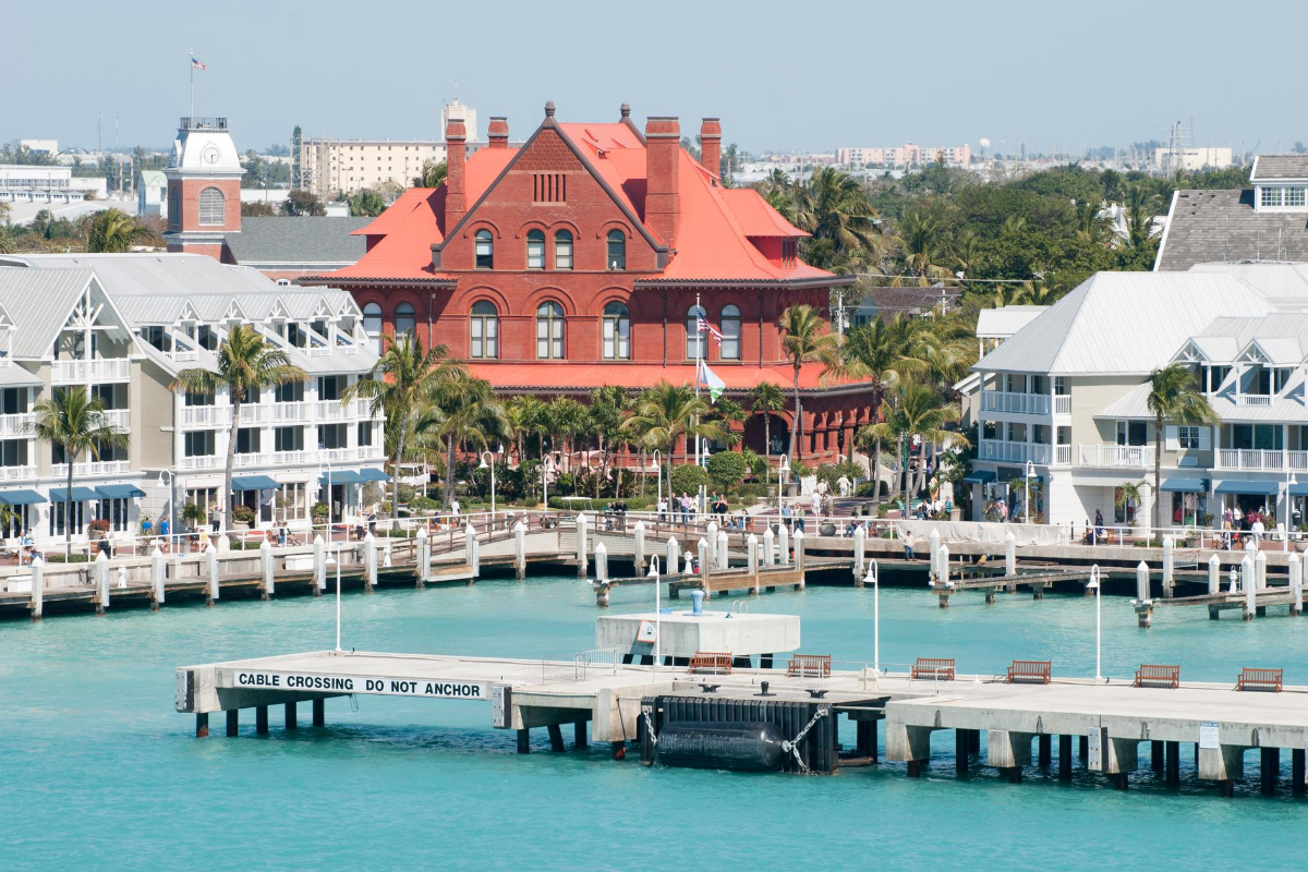 a boat is docked in front of a building