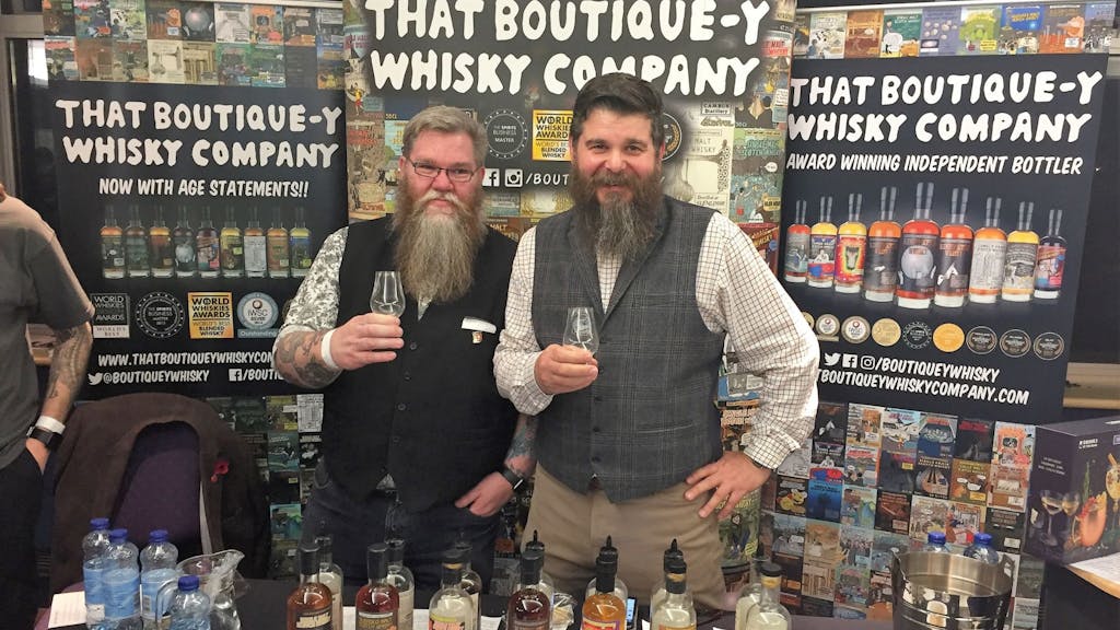 Two guys enjoying whisky at a whisky festival in Scotland
