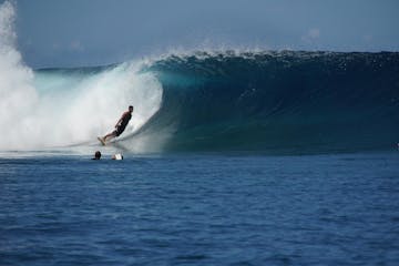 Man surfing in Teahupoo