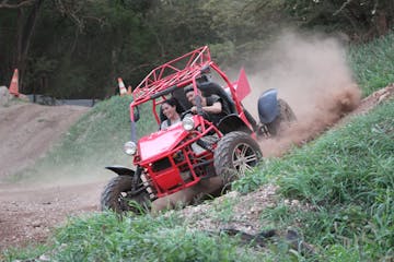 two people driving an ATV