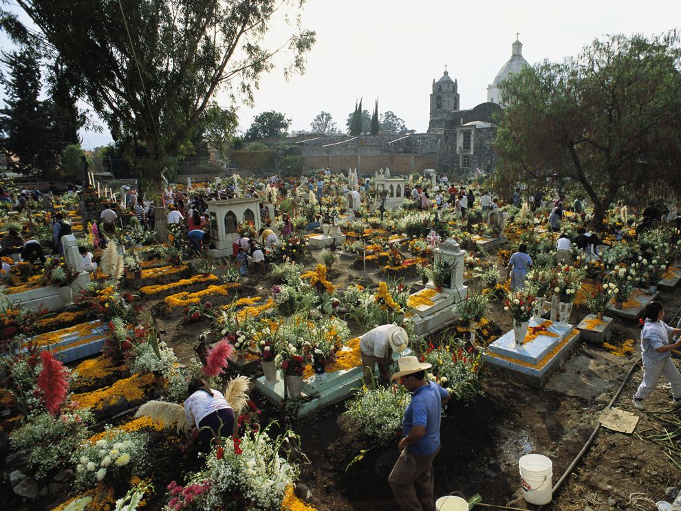 Mexican-graveyardCleaning the cemetery and decorating tombstones in preparation for Dia de los Muertos