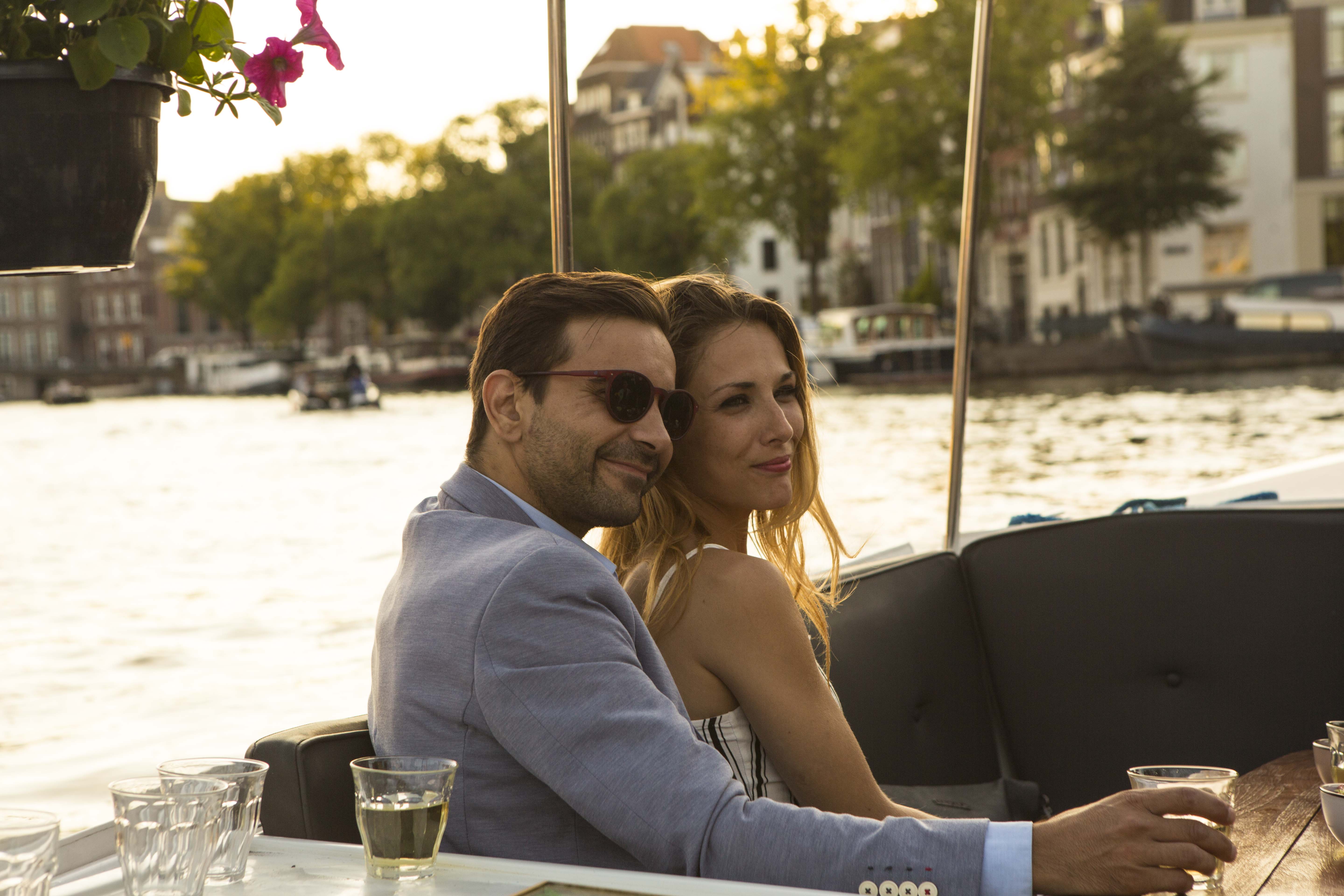 couple on the boat tour in romantic amsterdam