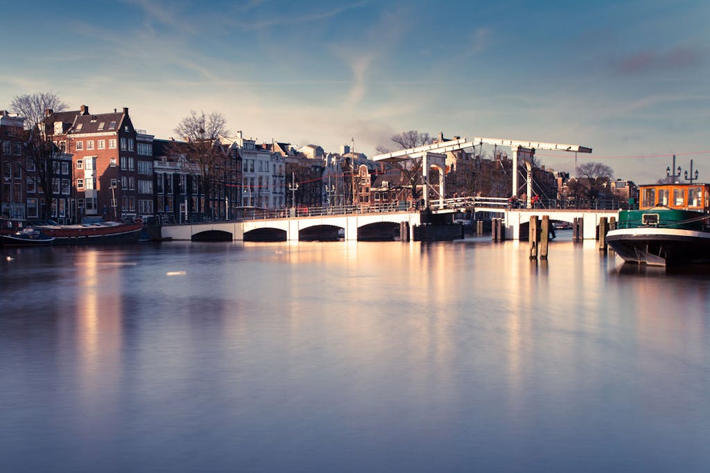 The skinny bridge in winter with frozen canals in Amsterdam