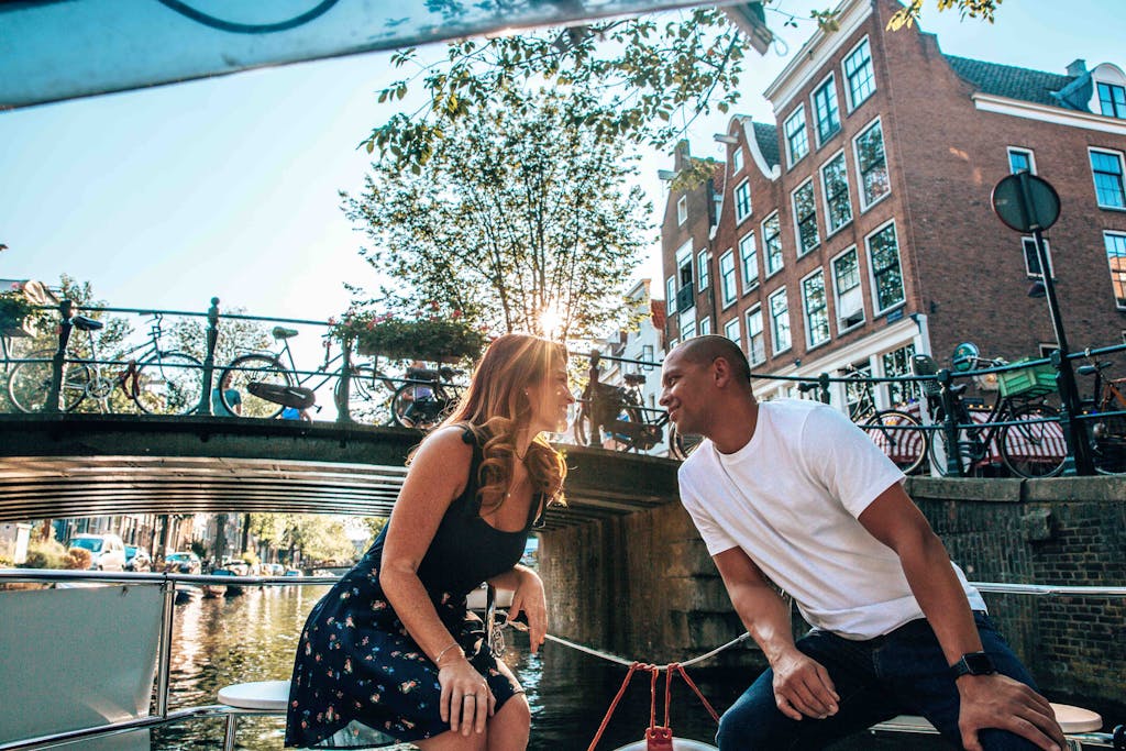 a couple on the romantic canal tour in Amsterdam