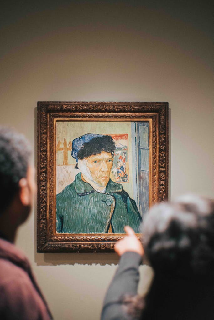 Visitors looking at Van Gogh picture at the museum in Amsterdam