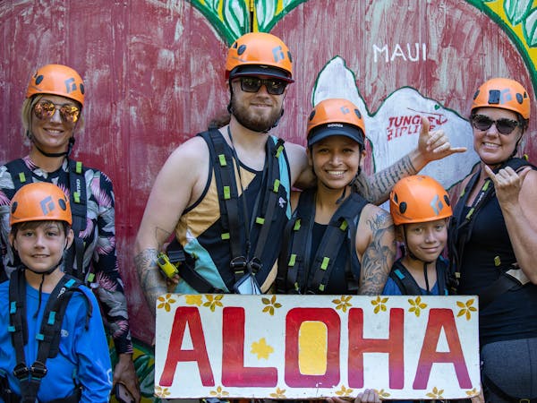 group posing with aloha sign