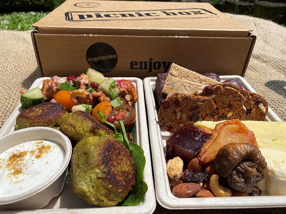 a box filled with different types of food on a table