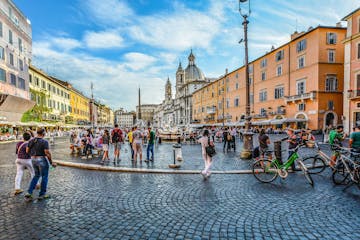 a group of people standing in front of Piazza Navona