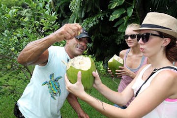 lloyd squeezing lime into a coconut