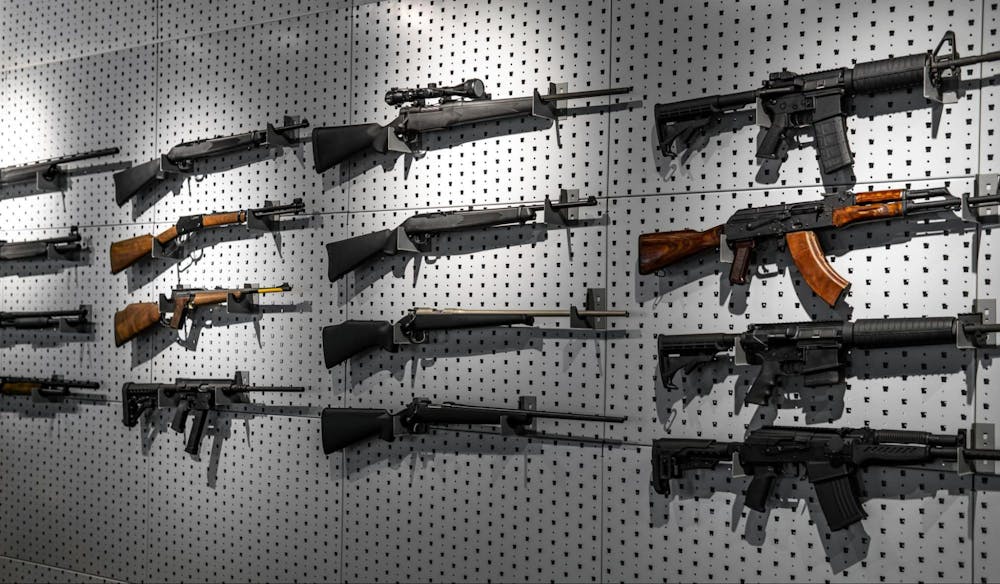 several guns displaying in a wall