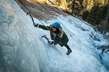 Girl ice climbing