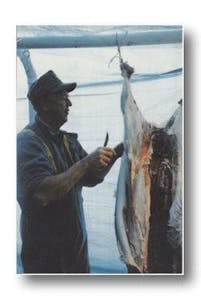 A photo of a guest skinning a deer back in 1999