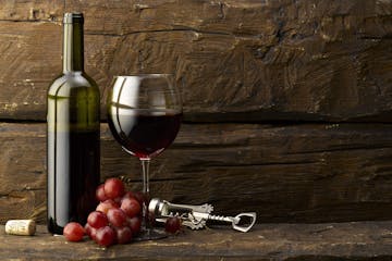 grapes with wine glass and bottle