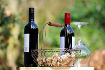 wine bottles and basket of corks