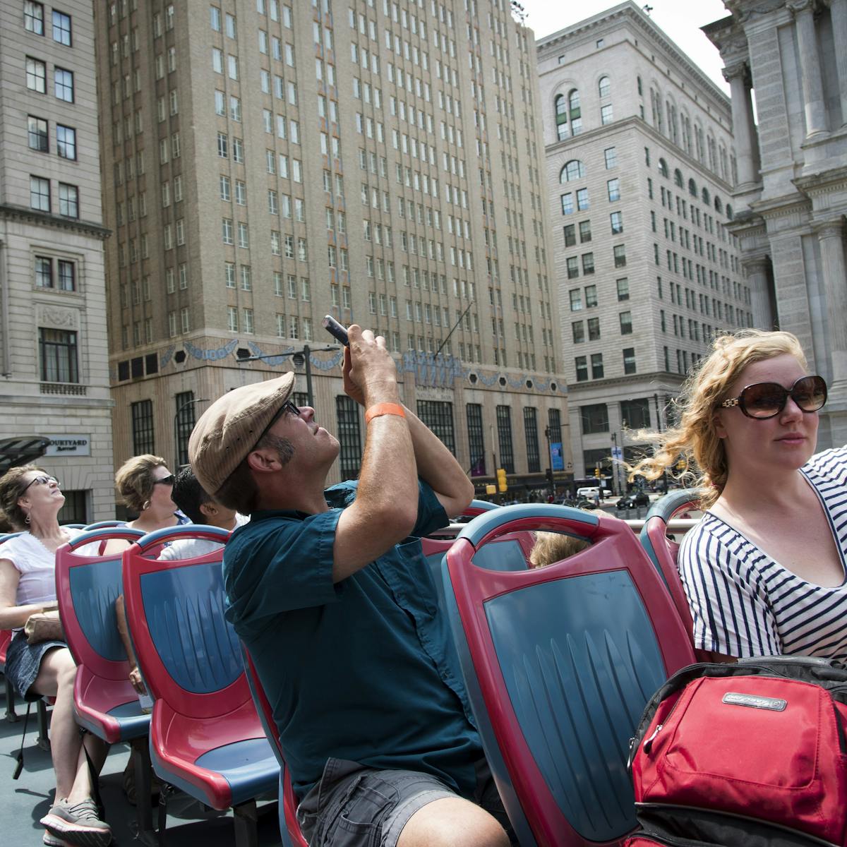 Philadelphia Sightseeing Tours passengers taking pictures of the city on the tour