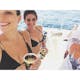 Women on catamaran drinking