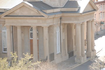 Huge lyme stone building with grecian columns