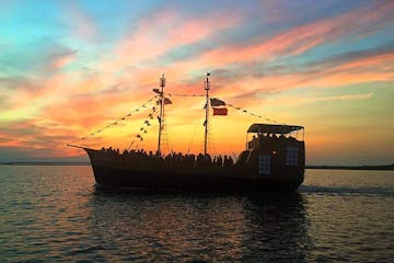 black pearl pirate ship at sunset