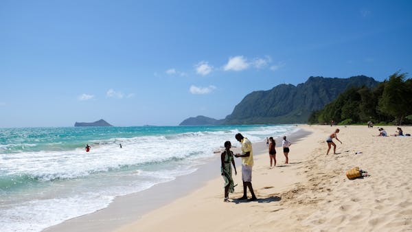 People on the beach in Oahu, Hawaii