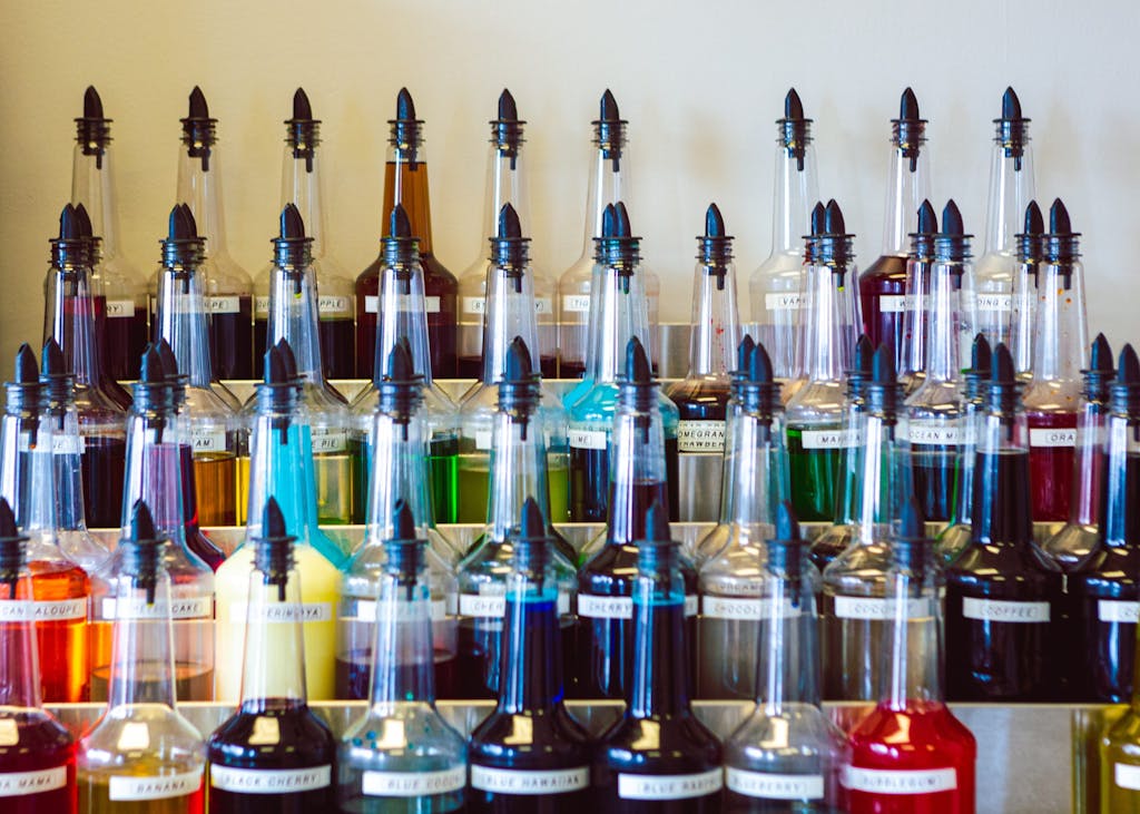 colorful-rainbow-of-bottles-with-shaved-ice-syrup--K8HWYHM5403