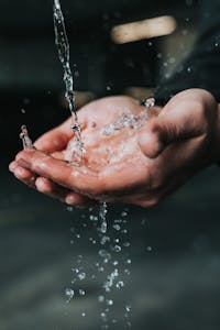 water running washing hands