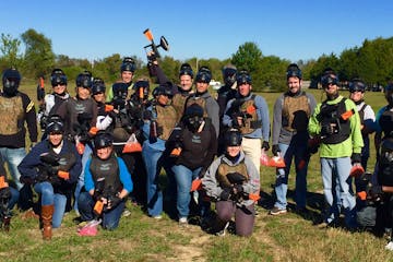 a large group of people with paintball guns
