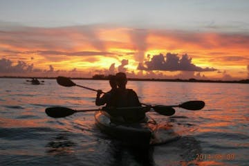 kayakers in sunset