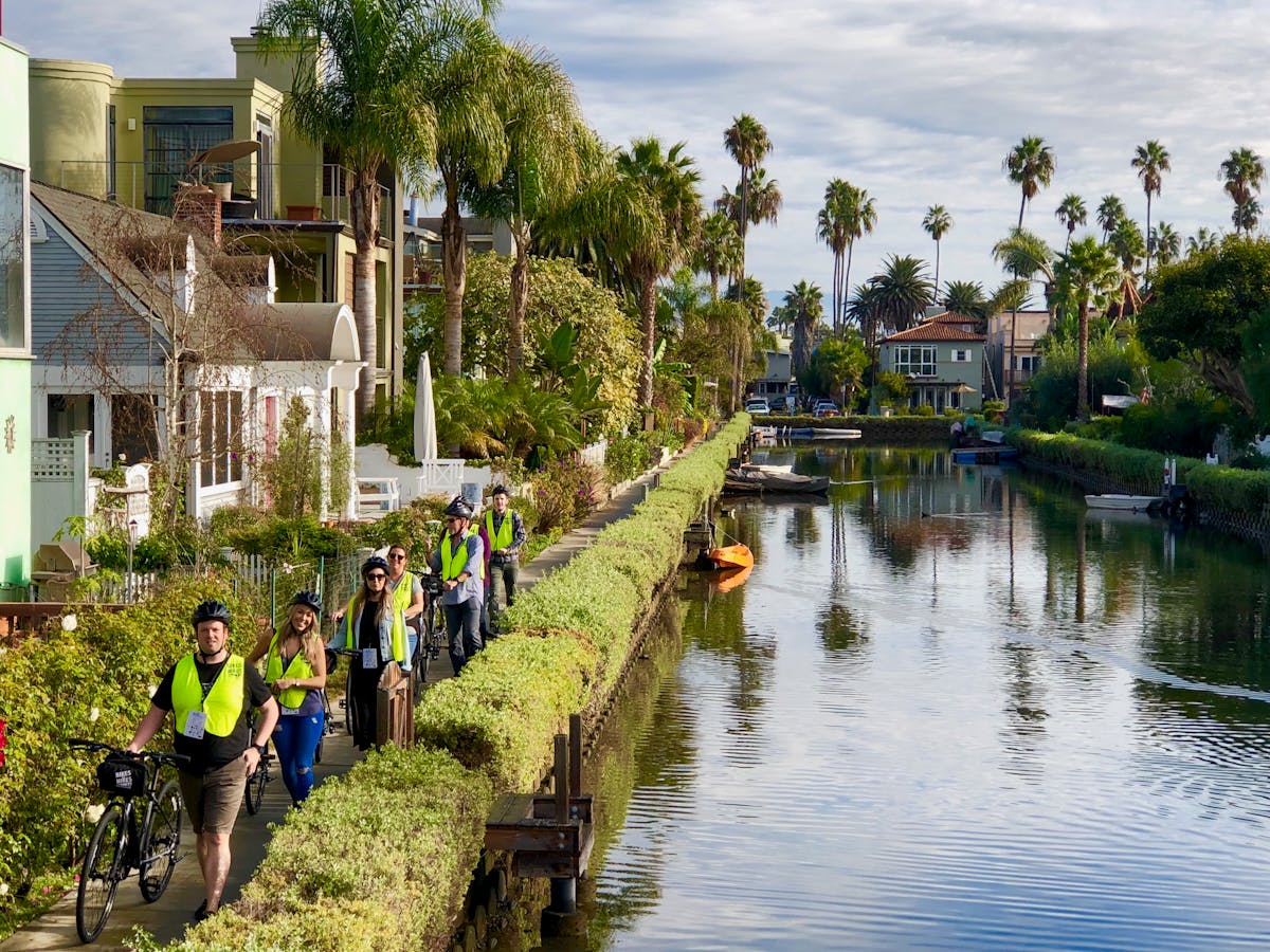 group of people by a river on a los angeles tour