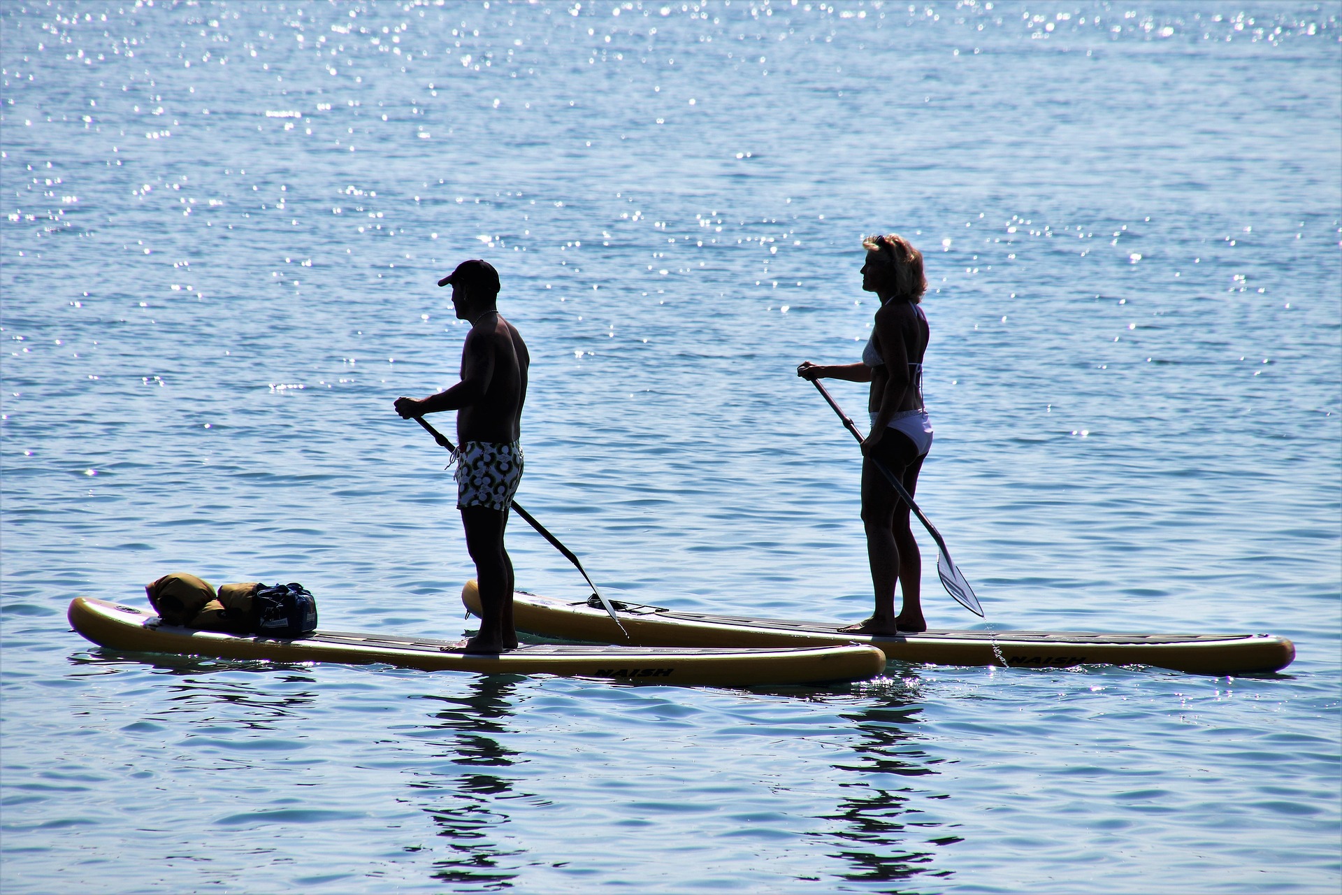 couple on stand up paddleboards