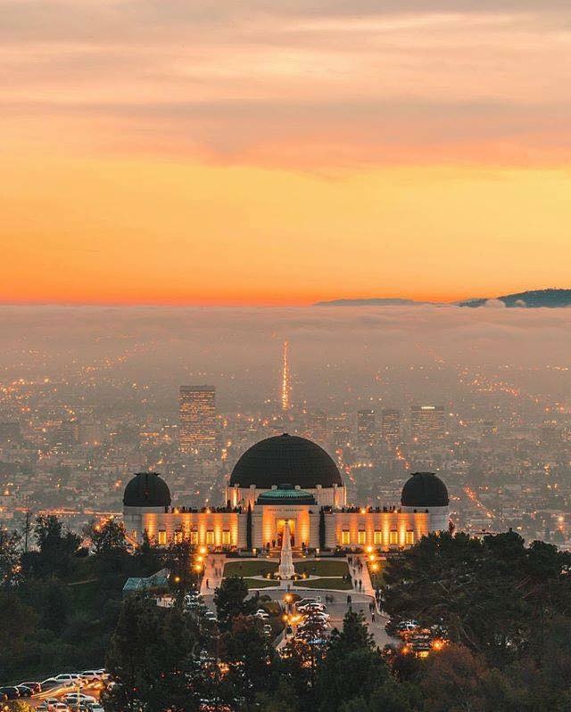 a view of the griffith observatory at night on our hollywood hills tour