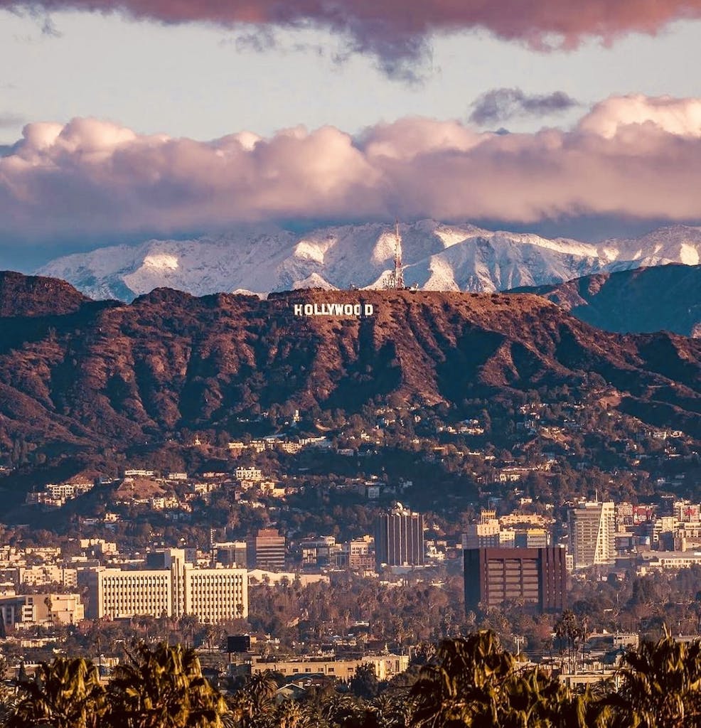 a view of the Hollywood Sign in the mountains in Los Angeles