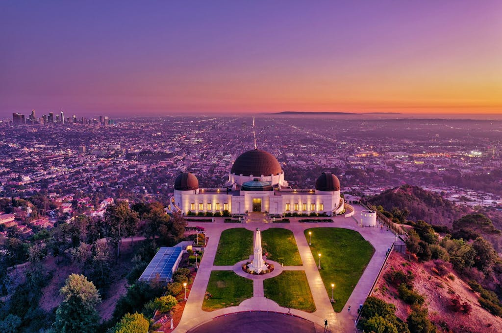 a picture of an observatory at sunset