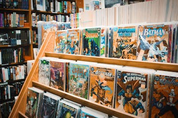 Comic books on a shelf.