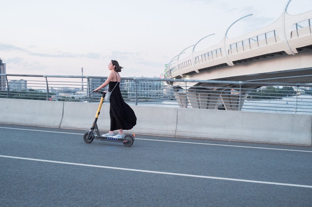 woman using e-scooter