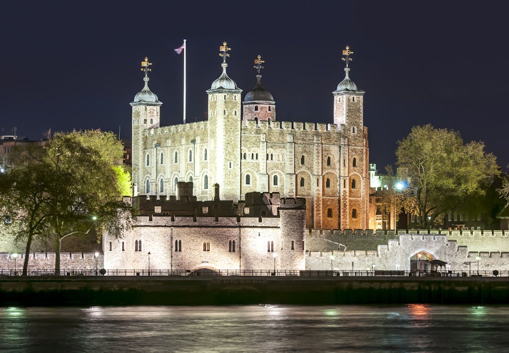 a castle with water in front of Tower of London