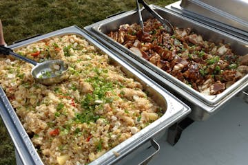 a tray of food with rice and vegetables