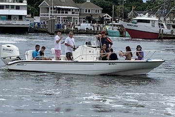 a group of people on a boat in the water