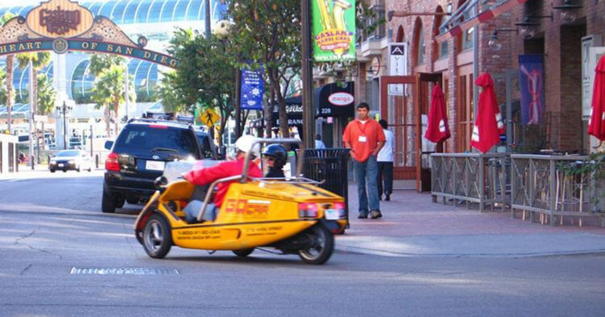 a person riding a gocar on a city street