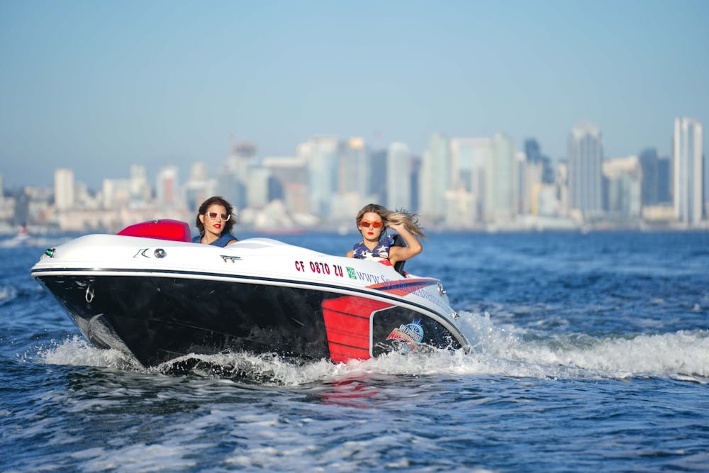 two women riding on a San Diego speed boat tour