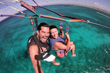 A couple parasailing in Aruba.