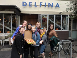 people eating pizza on a Sidewalk Food Tour of SF