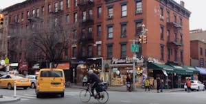 A man biking around the West Village in NYC